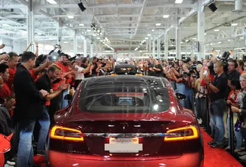 Owners and Tesla staff at the first Model S deliveries in 2012
